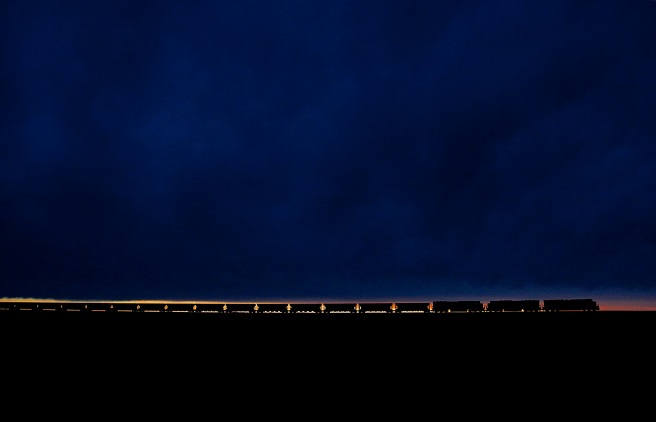 a long train against the horizon at nightfall